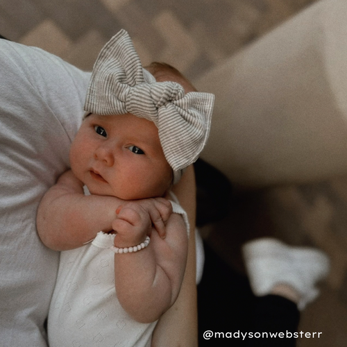 baby girl in stone ribbed bow headwrap